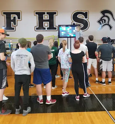 Farmington High School students looking at Heart Zones big board