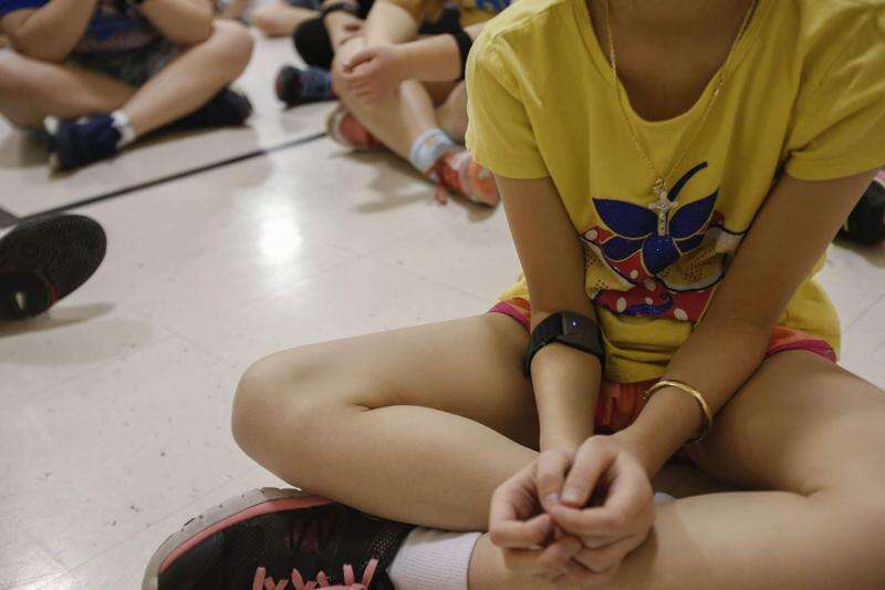 St. Matthew's PE student wearing heart rate monitor on forearm 