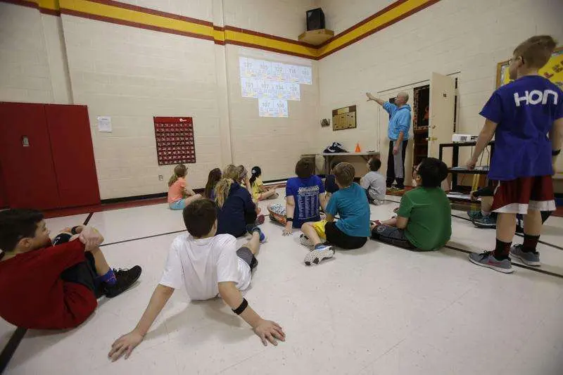 Heath showing St Matthews students their heart rate on the Heart Zones Big Board