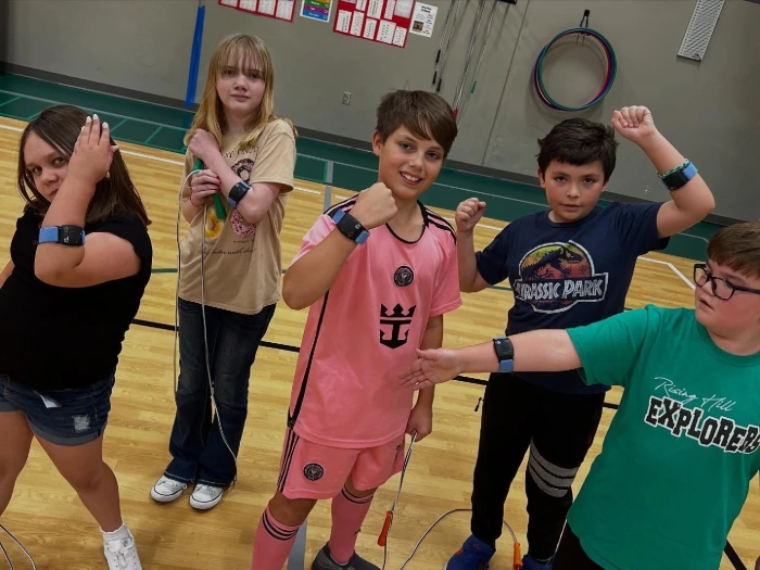 Rising Hill Elementary students wearing Heart Zones' PE technology